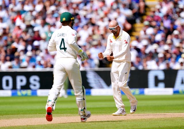 Nathan Lyon (right) celebrates the wicket of Jonny Bairstow