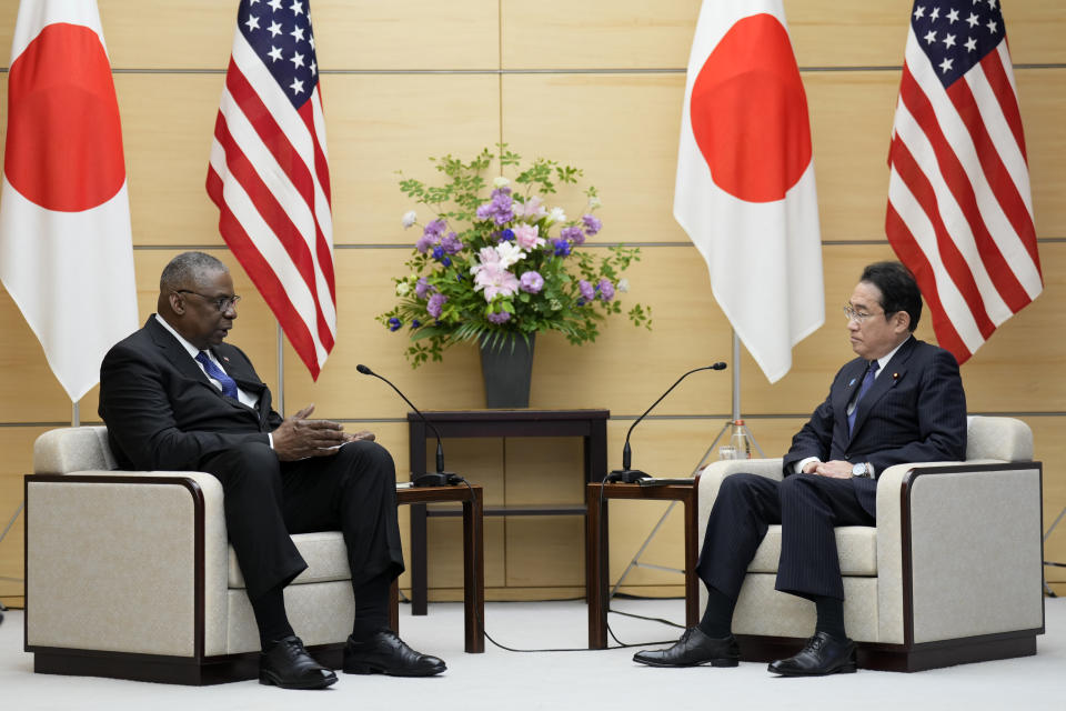 U.S. Defense Secretary Lloyd Austin, left, and Japanese Prime Minister Fumio Kishida speak during their meeting at the prime minister's office in Tokyo Thursday, June 1, 2023. (AP Photo/Eugene Hoshiko, Pool)