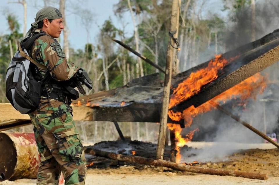 Perú’s Ministry of Interior released this photo showing Peruvian police destroying dredges, engines and other mineral-extracting equipment from illegal gold mining grounds in the Tambopata area, in Perú’s Madre de Dios region on Sept. 25, 2013. More than 400 troops were deployed in the operation in this region where illegal gold mining has already destroyed hundreds of acres of jungle.