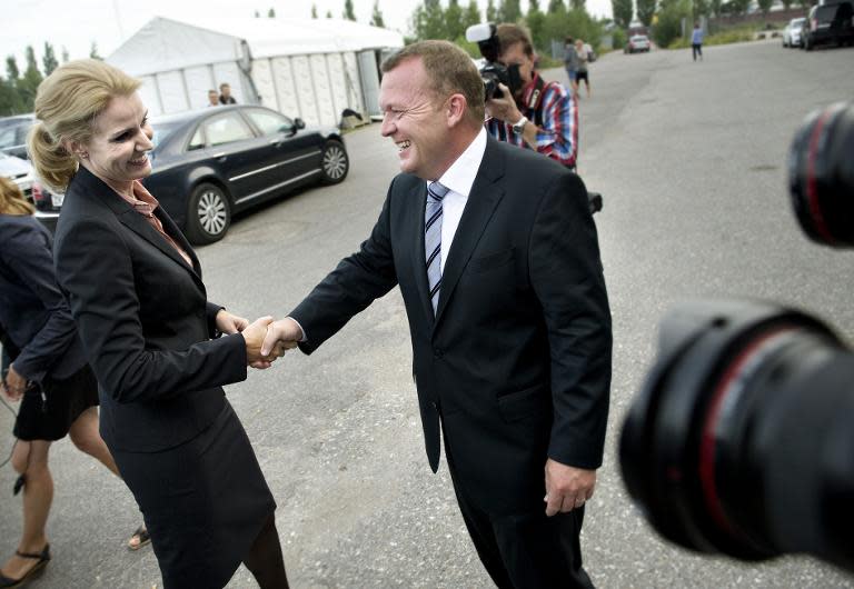 Lars Loekke Rasmussen (R), pictured here in 2011 with Helle Thorning-Schmidt, was prime minister from 2009 to 2011