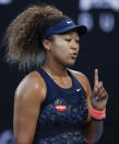 Japan's Naomi Osaka gestures during her second round match against France's Caroline Garcia at the Australian Open tennis championship in Melbourne, Australia, Wednesday, Feb. 10, 2021.(AP Photo/Rick Rycroft)