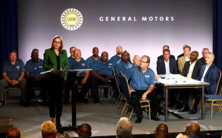 General Motors Chairman and CEO Mary Barra makes a statement as United Auto Workers President Gary Jones listens during the start of contract talks between the union and automaker in Detroit