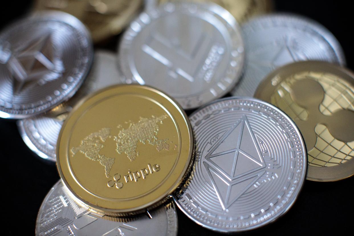 In this photo, illustration of litecoin, ripple and ethereum cryptocurrency ‘altcoins’ arranged for a photograph in London, England (Getty Images)