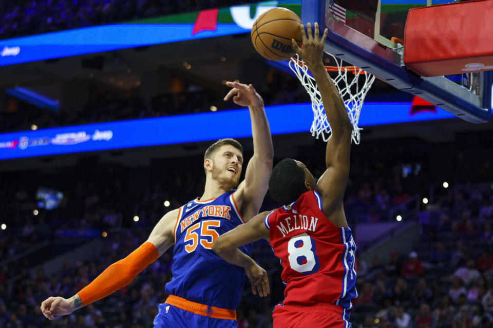 New York Knicks' Isaiah Hartenstein, left, blocks the shot attempt by Philadelphia 76ers' De'Anthony Melton during the second half of an NBA basketball game Friday, Nov. 4, 2022, in Philadelphia. The Knicks won 106-104. (AP Photo/Chris Szagola)