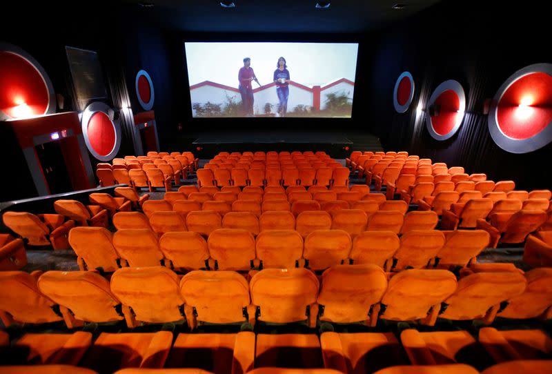 Empty chairs are seen during a movie time at City Gold cinema after its reopening in Ahmedabad