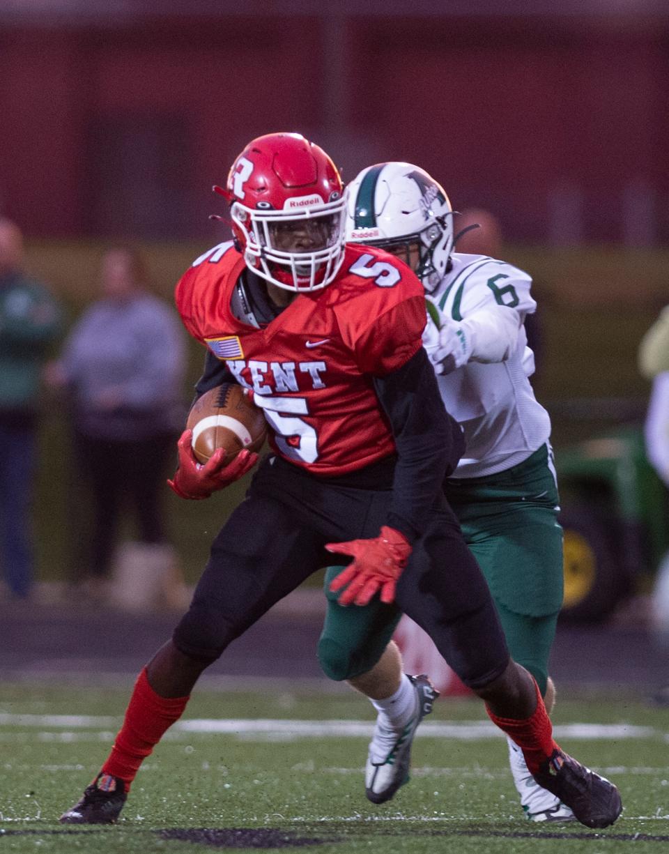 Kent Roosevelt's Tyrel Ellington is pursued by Aurora's Cade Fromwiller during last Friday's game in Kent.