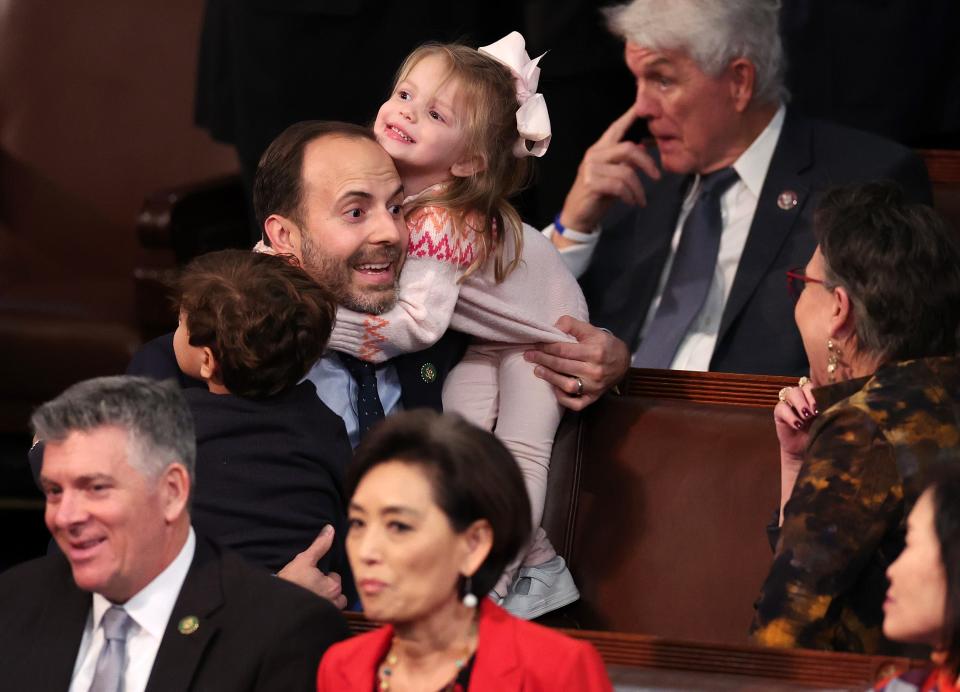 U.S. Rep.-elect Lance Gooden (R-TX) carries his children Milla and Liam into the House Chamber during the fourth day of elections for Speaker of the House at the U.S. Capitol Building on January 06, 2023 in Washington, DC.