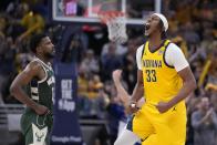 Indiana Pacers' Myles Turner reacts during the second half of Game 4 of the first round NBA playoff basketball series against the Milwaukee Bucks, Sunday, April 28, 2024, in Indianapolis. (AP Photo/Michael Conroy)
