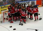 Canada's players celebrate defeating Russia in their Ice Hockey World Championship final game at the O2 arena in Prague, Czech Republic May 17, 2015. REUTERS/Laszlo Balogh