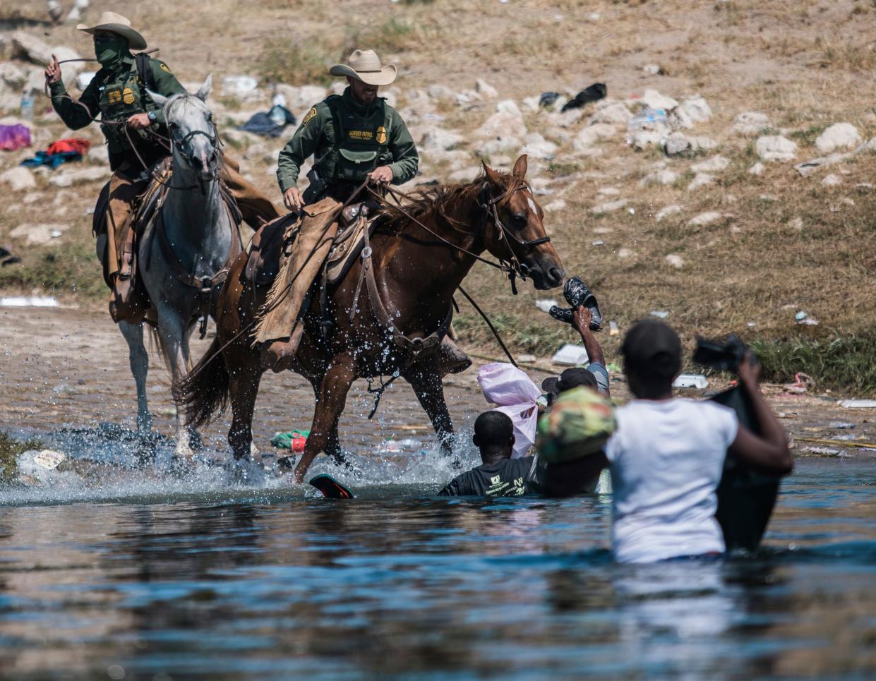 Haitian migrants are confronted by Customs and Border Protection agents in Del Rio, Texas  (Copyright 2021 The Associated Press. All rights reserved)