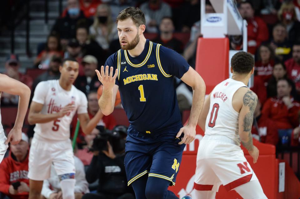 Michigan Wolverines center Hunter Dickinson (1) signals after scoring against the Nebraska Cornhuskers in the first half at Pinnacle Bank Arena on Dec. 7, 2021.