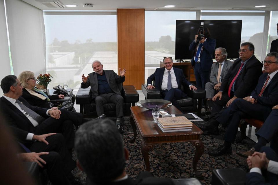 Brazil's President Luiz Inacio Lula Da Silva, centre left, meets with Supreme Court ministers and his cabinet at Planalto Presidential Palace in Brasilia (AFP/Getty)