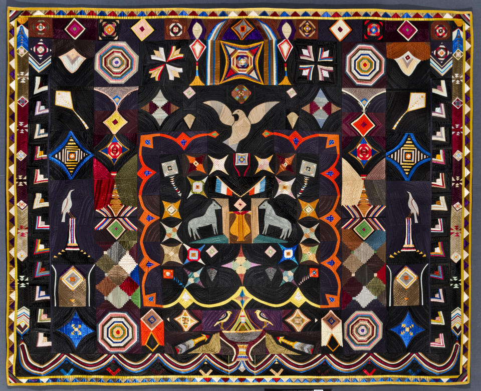 This image provided by the American Folk Art Museum shows the Original Design Quilt made by Corning, NY tailor Carl Klewicke around 1907. The piece is made of vivid bits of silk, faille, taffeta and satin depicting stars, kites and doves. The joyful piece took Mr. Klewicke 20 years to finish and was given by him and his wife to their daughter on her wedding day. (American Folk Art Museum via AP)