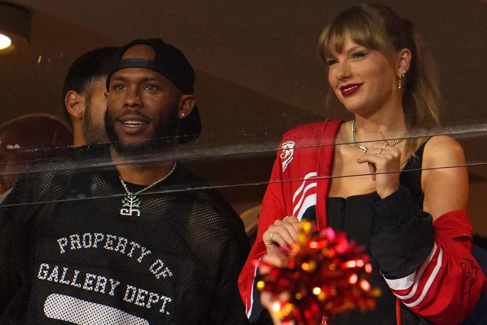 <p>Cooper Neill/Getty </p>  Taylor Swift and Aric Jones watch the Kansas City Chiefs play the Denver Broncos at GEHA Field at Arrowhead Stadium 