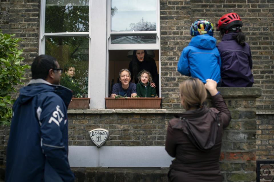 **Parental permission granted** Two families maintain social distancing while talking to each other outside a home in Hampstead, north London, as the UK continues in lockdown to help curb the spread of the coronavirus. (Photo by Victoria Jones/PA Images via Getty Images)