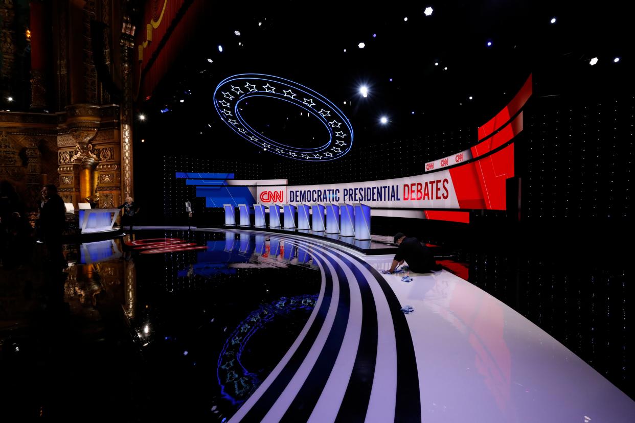 Workers prepare the debate stage at the Fox Theater in Detroit