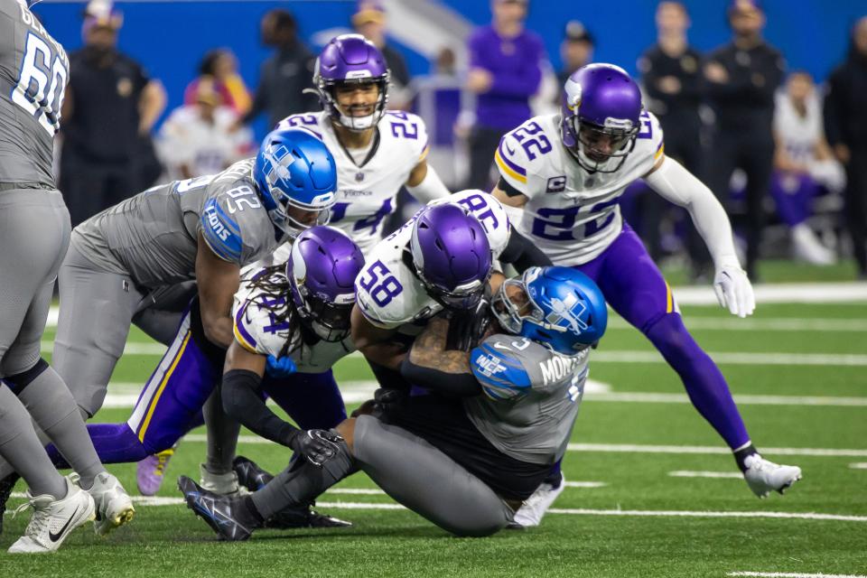 Minnesota Vikings linebacker Jordan Hicks (58) tackles Detroit Lions running back David Montgomery (5) on Jan 7 in Detroit.