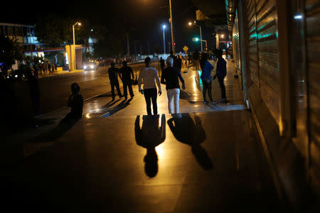 People walk near the the Malecon, following the announcement of the death of Cuban revolutionary leader Fidel Castro, in Havana, Cuba November 27, 2016. REUTERS/Carlos Barria