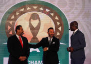 Soccer Football - African Champions League Group Stage Draw - Nile Ritz-Carlton Hotel, Cairo, Egypt - December 28, 2018 Former Egypt players Hazem Emam and Magdi Abdelghani with Anthony Baffoe, CAF deputy general secretary before the CAF Champions League Group Stage Draw REUTERS/Amr Abdallah Dalsh