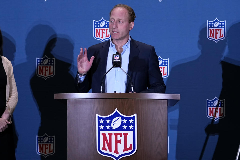 FILE -Jeff Miller, NFL Executive Vice President, Communications, Public Affairs and Policy, speaks during a news conference at the NFL football meetings, Monday, March 27, 2023, in Phoenix. The NFL is looking to eliminate the hip-drop tackle and will again discuss the "tush push" in the offseason. League executive Jeffrey Miller said Tuesday, Oct. 17, 2023 the hip-drop tackle increases risk of injury by 25 times the rate of a standard tackle.(AP Photo/Matt York, File)