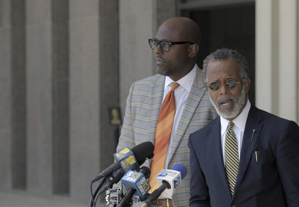 Defense attorneys J. Wyndal Gordon, left, and Warren Brown speak following the life sentence, meted out for 17-year-old Dawnta Harris at Baltimore County Circuit Court Wednesday, Aug. 21, 2019, in Towson, Md. Harris was tried as an adult earlier this year and convicted of felony murder in the slaying of Baltimore County police Officer Amy Caprio. Caprio encountered Harris in May 2018 while responding to a report of a suspicious vehicle. (Karl Merton Ferron/The Baltimore Sun via AP)