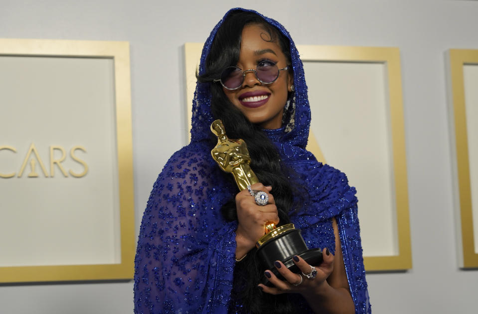 FILE - H.E.R., winner of the award for best original song for "Fight For You" from "Judas and the Black Messiah," poses in the press room at the Oscars on April 25, 2021, in Los Angeles. H.E.R. turns 24 on June 27. (AP Photo/Chris Pizzello, Pool, File)