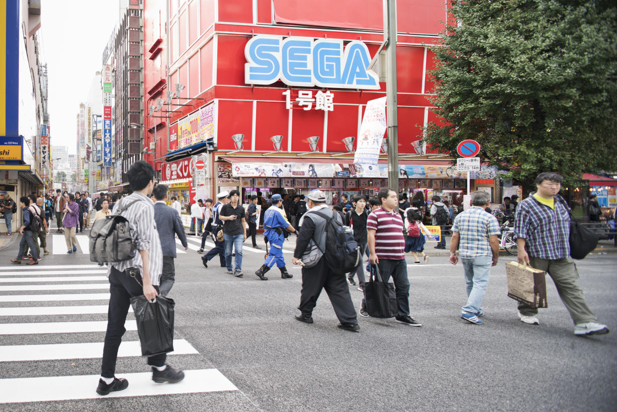 Tokyo, Japan - October 1, 2017. Pedestrians on the streets outside of a SEGA video game arcade in the Akihabara District of Tokyo the capital of Japan. (Photo: Getty)