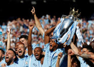 <p>Soccer Football – Premier League – Manchester City vs Huddersfield Town – Etihad Stadium, Manchester, Britain – May 6, 2018 Manchester City’s Vincent Kompany celebrates with the trophy after winning the Premier League title REUTERS/Phil Noble EDITORIAL USE ONLY. No use with unauthorized audio, video, data, fixture lists, club/league logos or “live” services. Online in-match use limited to 75 images, no video emulation. No use in betting, games or single club/league/player publications. Please contact your account representative for further details. </p>