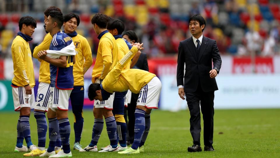 Japan coach Hajime Moriyasu with his players in September (Getty Images)