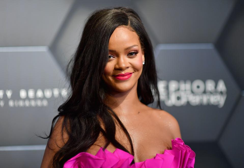 Rihanna wore an eye-popping fuchsia gown to the birthday bash of her cosmetics company, Fenty Beauty, on Friday night.