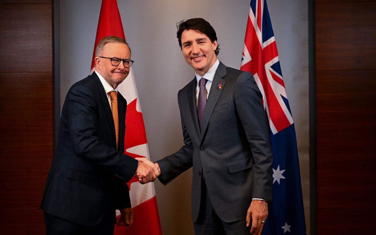 Anthony Albanese shakes hands with Justin Trudeau during a bilateral meeting in Madrid - LUKAS COCH/EPA-EFE/Shutterstock