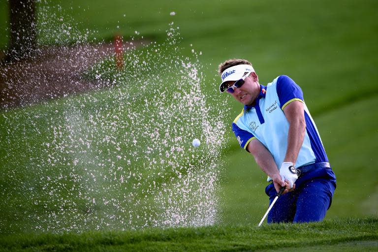 Ian Poulter of England plays his shot out of a bunker on the 14th hole during the continuation of the fourth round of The Honda Classic on March 2, 2015 in Palm Beach Gardens, Florida