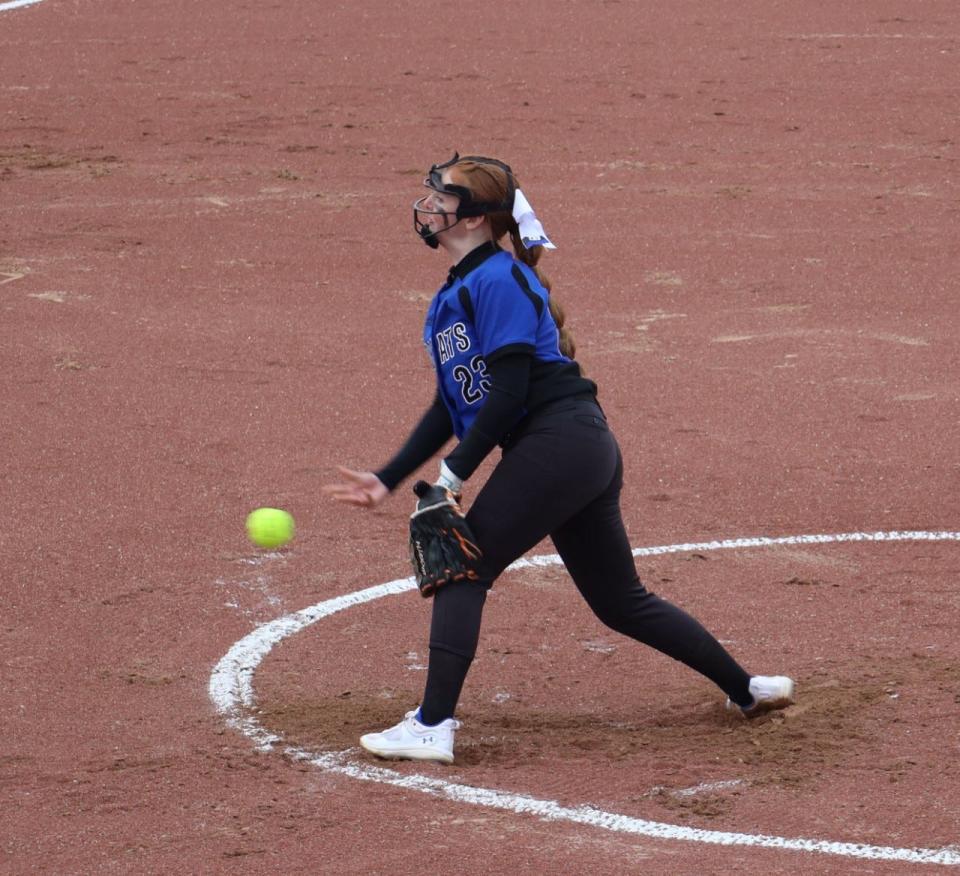 Cambridge starting pitcher Kenzi Hickman delivers a pitch during Tuesday's home opener with Harrison Central at Cambridge City Park.