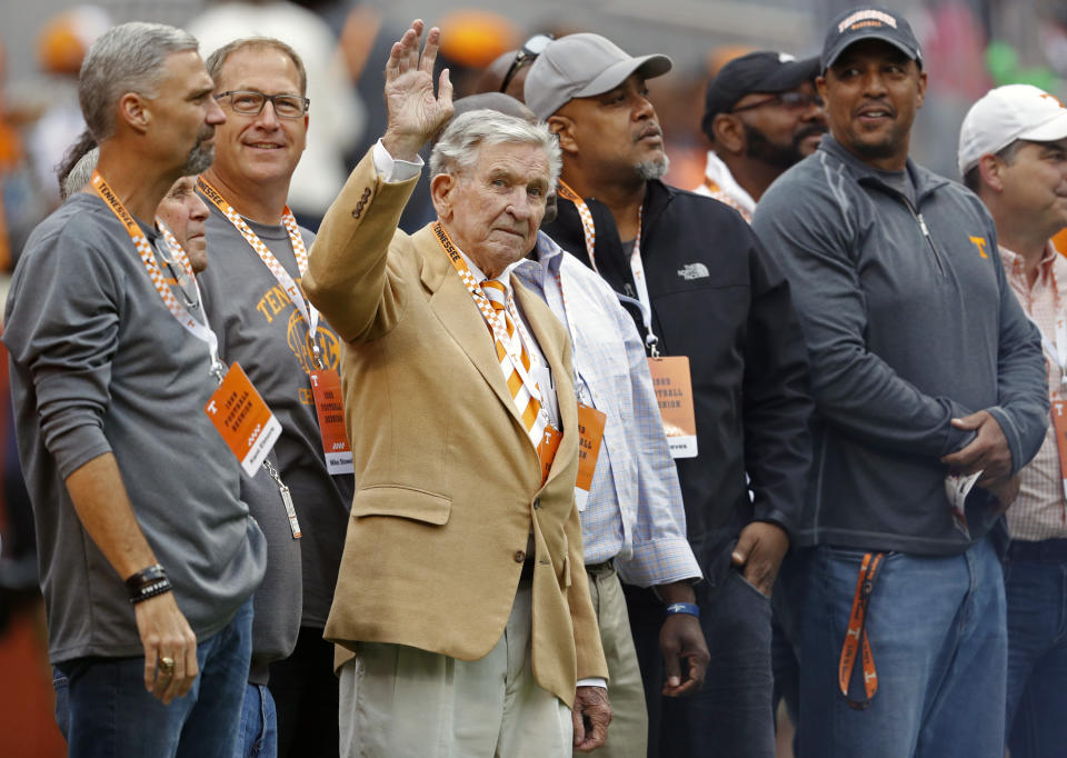 FILE - In this Oct. 12, 2019, file photo, former Tennessee head football coach Johnny Majors waves to fans as he and members of the 1998 football team are introduced in the first half of an NCAA college football game against Mississippi State, in Knoxville, Tenn. Majors, the coach of Pittsburgh’s 1976 national championship team and a former coach and star player at Tennessee, has died. He was 85. Majors died Wednesday morning, June 3, 2020, at home in Knoxville, Tenn., according to a statement from his wife, Mary Lynn Majors. (AP Photo/Wade Payne, FIle)