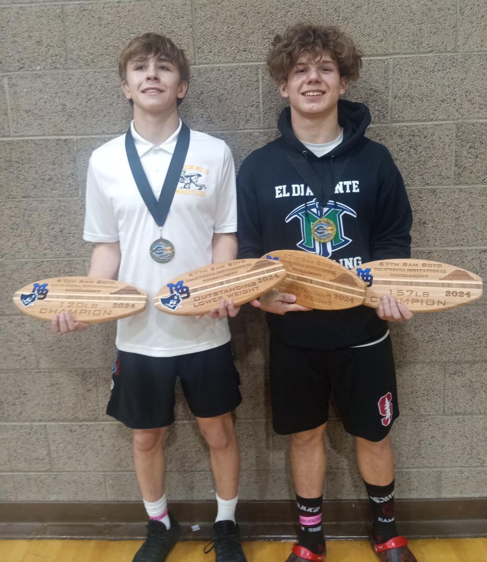 Golden West's Caleb Rivas, left, and El Diamante's Christopher Creason each captured first place in their respective wrestling division on Saturday at the annual California Invitational Tournament in Morro Bay.