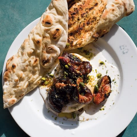 Charcoal-grilled black figs, burrata, date molasses and za’atar flatbread - Credit: Andy Sewell