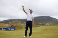 Golf - European Tour - Irish Open - Ballyliffin Golf Club, Ballyliffin, Ireland - July 8, 2018 Scotland's Russell Knox celebrates with the trophy after winning the 2018 Irish Open Action Images via Reuters/Craig Brough