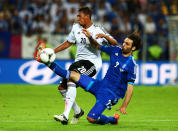 GDANSK, POLAND - JUNE 22: Giorgos Samaras of Greece tackles Jerome Boateng of Germany during the UEFA EURO 2012 quarter final match between Germany and Greece at The Municipal Stadium on June 22, 2012 in Gdansk, Poland. (Photo by Alex Grimm/Getty Images)