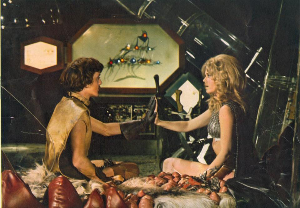 David Hemmings as Dildano and Fonda as Barbarella in a world where lovemaking is conducted by taking pills and pushing palms together until full rapport is achieved (Moviestore/Shutterstock)
