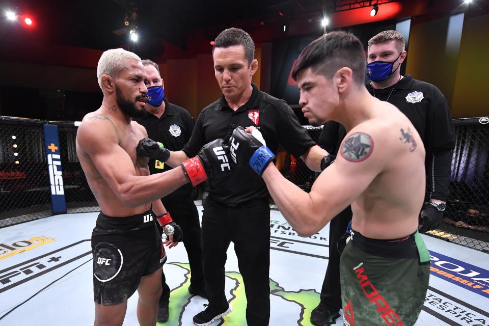 LAS VEGAS, NEVADA - DECEMBER 12:  (L-R) Deiveson Figueiredo of Brazil and Brandon Moreno of Mexico touch gloves prior to their flyweight championship bout during the UFC 256 event at UFC APEX on December 12, 2020 in Las Vegas, Nevada. (Photo by Jeff Bottari/Zuffa LLC)