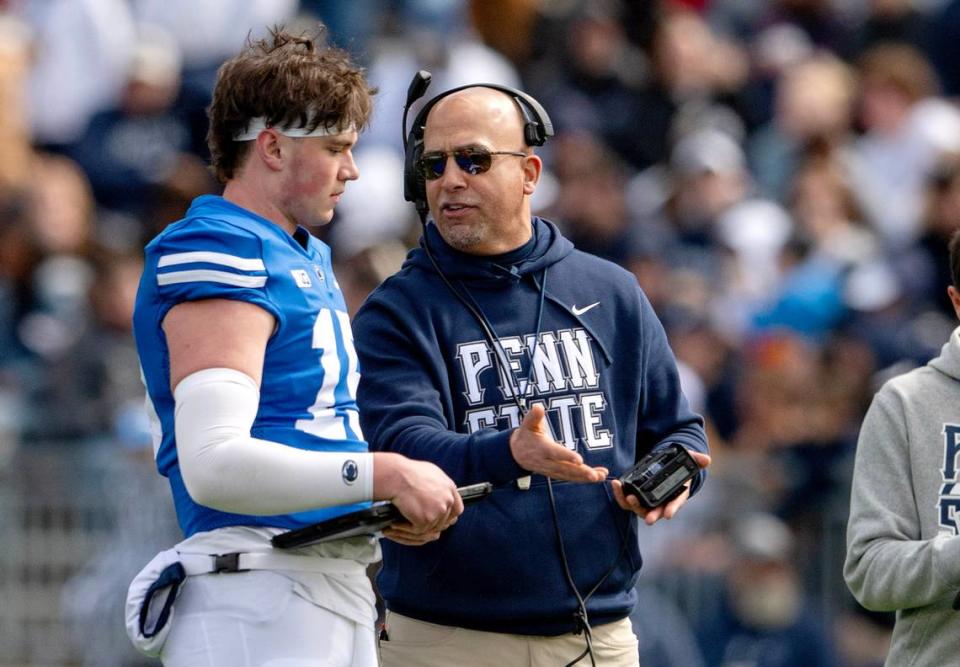 Penn State football coach James Franklin talks to quarterback <a class="link " href="https://sports.yahoo.com/ncaaf/players/333440/" data-i13n="sec:content-canvas;subsec:anchor_text;elm:context_link" data-ylk="slk:Drew Allar;sec:content-canvas;subsec:anchor_text;elm:context_link;itc:0">Drew Allar</a> during the Blue-White game on Saturday, April 13, 2024. Abby Drey/adrey@centredaily.com