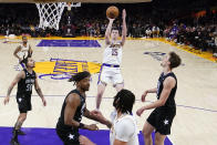 Los Angeles Lakers guard Austin Reaves (15) shoots against the Orlando Magic during the second half of an NBA basketball game Sunday, March 19, 2023, in Los Angeles. (AP Photo/Marcio Jose Sanchez)