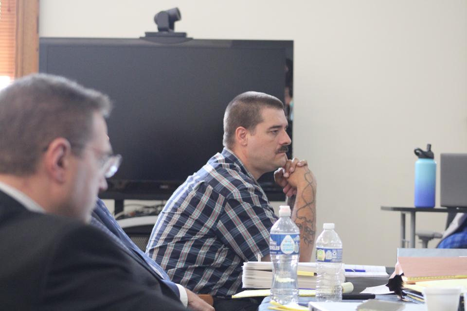 Defendant Eric Molitor listens to the testimony from FBI Agent Henrik "Hank" Impola on Aug. 25, 2023.