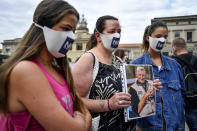 Members of Noi Denunceremo (We will denounce) group arrive at Bergamo's court, Italy, Monday, July 13, 2020. Lawyers for the Noi Denunceremo (We Will Denounce) Facebook group and an affiliated non-profit committee are filing 100 new cases Monday with Bergamo prosecutors investigating the outbreak, on top of 50 complaints lodged last month. ( Claudio Furlan/LaPresse via AP)