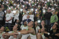 Oregon's Sabrina Ionescu watches a tribute to Kobe Bryant after Oregon clinched the Pac 12 Championship with a 88-57 win against Washington State in an NCAA college basketball game in Eugene, Ore., Friday, Feb. 28, 2020. (AP Photo/Collin Andrew)