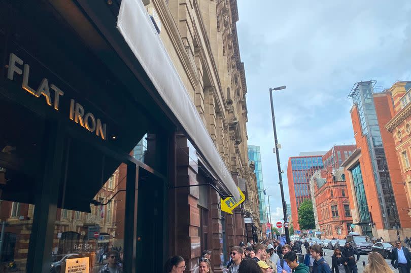 The queue outside the new Flat Iron restaurant -Credit:MEN