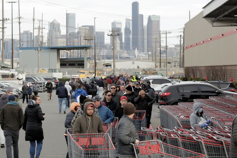 Shoppers line up at a Costco store, following reports of coronavirus disease (COVID-19) cases in the country, in Seattle