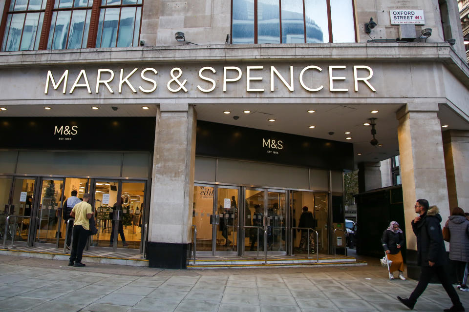 LONDON, UNITED KINGDOM - 2020/11/07: People walk past a branch of Marks and Spencer on Oxford Street in central London. (Photo by Dinendra Haria/SOPA Images/LightRocket via Getty Images)