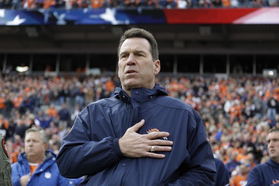 Denver Broncos coach Gary Kubiak stands during the singing of the national anthem before the team's NFL football game against the Oakland Raiders, Sunday, Jan. 1, 2017, in Denver. (AP Photo/Jack Dempsey)