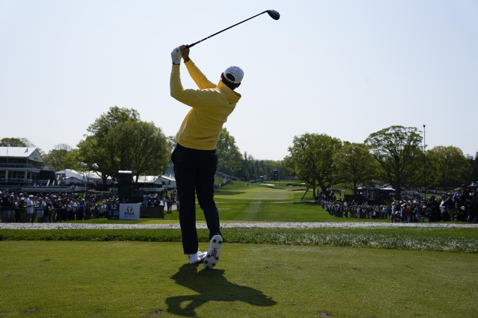 Scottie Scheffler watches his tee shot on the 12th hole during the first round of the PGA Championship golf tournament at Oak Hill Country Club on Thursday, May 18, 2023, in Pittsford, N.Y. (AP Photo/Seth Wenig)